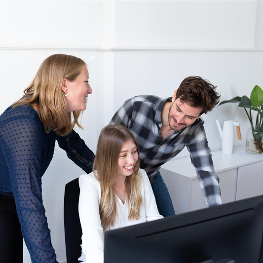 Team works together in the DERMALOG office.